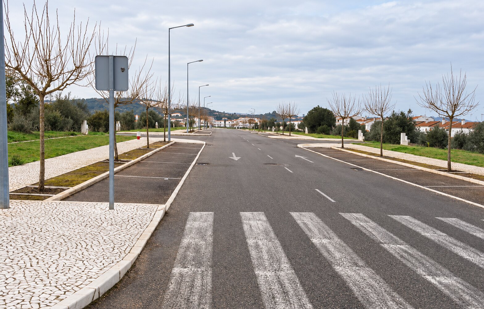 Paved road, pavement and street lighting beside the land in Vila Viçosa